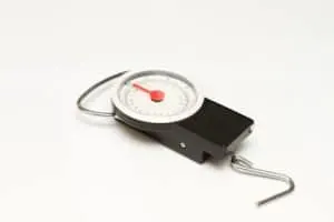 The picture shows a weighing scale than can be used to weigh carry on baggage